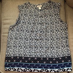 Black/white top, decorative trim at hem and 3/4 button front, 100% polyester.